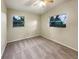 Well-lit bedroom with neutral colored walls and carpet at 3700 Timber Trl, Orlando, FL 32808