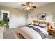 Bright bedroom with a king-size bed, large closet, and en-suite bathroom at 3700 Timber Trl, Orlando, FL 32808