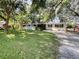 Ranch style home with carport, mature landscaping, and spacious yard at 3700 Timber Trl, Orlando, FL 32808
