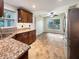 Kitchen with granite countertops and wooden cabinets at 3700 Timber Trl, Orlando, FL 32808