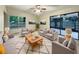 Bright living room featuring neutral furniture and a view of the backyard at 3700 Timber Trl, Orlando, FL 32808