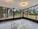 Screened porch overlooking backyard with shed at 3700 Timber Trl, Orlando, FL 32808