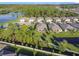 Community overview showcasing homes near a pond at 3813 Myrtle Oak Ct, Clermont, FL 34714