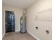 Laundry area with shelving and water heater at 5235 Botany Ct, Orlando, FL 32811