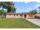 Ranch style home with stone facade and spacious yard at 6427 Sunshine St, Orlando, FL 32818
