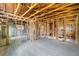Under construction home with exposed framing and new flooring at 6427 Sunshine St, Orlando, FL 32818