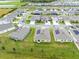 Aerial view of a neighborhood with solar panels at 729 Hitch Loop, St Cloud, FL 34772