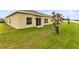 Spacious backyard with grassy lawn and mature trees at 729 Hitch Loop, St Cloud, FL 34772