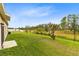 Large backyard with a view of open fields at 729 Hitch Loop, St Cloud, FL 34772