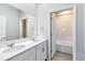 Double sink bathroom with a tub and shower at 729 Hitch Loop, St Cloud, FL 34772