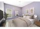 Bedroom with queen bed and neutral decor at 729 Hitch Loop, St Cloud, FL 34772