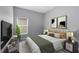 Bright bedroom with a king-size bed and decor at 729 Hitch Loop, St Cloud, FL 34772