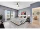 Main bedroom with large windows and comfortable bed at 729 Hitch Loop, St Cloud, FL 34772
