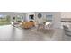 Open concept dining area with modern decor and a view to the living room at 729 Hitch Loop, St Cloud, FL 34772
