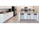 Modern kitchen with white cabinets and grey countertops at 729 Hitch Loop, St Cloud, FL 34772