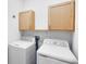 Laundry room with washer, dryer, and cabinets at 729 Hitch Loop, St Cloud, FL 34772