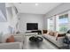 Spacious living room with large windows and comfortable seating at 729 Hitch Loop, St Cloud, FL 34772
