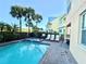 Community pool and spa with lounge chairs at 8033 Surf St, Kissimmee, FL 34747