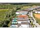 Aerial view of community with houses and conservation area at 836 Desert Mountain Ct, Reunion, FL 34747