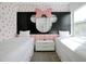 Minnie Mouse themed bedroom with twin beds and built in shelving at 836 Desert Mountain Ct, Reunion, FL 34747