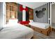 Mickey Mouse themed bedroom with twin beds, built-in shelves, and red accents at 836 Desert Mountain Ct, Reunion, FL 34747