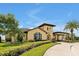 Community clubhouse with inviting entryway and landscaping at 836 Desert Mountain Ct, Reunion, FL 34747