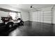 Garage with golf cart and epoxy flooring at 836 Desert Mountain Ct, Reunion, FL 34747