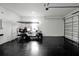 Garage with golf cart and epoxy flooring at 836 Desert Mountain Ct, Reunion, FL 34747