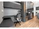 Home office features built-in desk and modern chair at 836 Desert Mountain Ct, Reunion, FL 34747