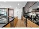 Modern kitchen with stainless steel appliances and a large island at 836 Desert Mountain Ct, Reunion, FL 34747