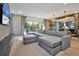 Spacious living area with sectional sofa, and access to the backyard at 836 Desert Mountain Ct, Reunion, FL 34747
