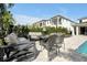 Relaxing patio area with fire pit and seating at 836 Desert Mountain Ct, Reunion, FL 34747