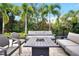 Outdoor seating area with fire pit and lush landscaping at 836 Desert Mountain Ct, Reunion, FL 34747