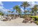 Poolside bar area with picnic tables and umbrellas at 836 Desert Mountain Ct, Reunion, FL 34747