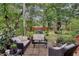 Private backyard oasis with patio furniture and lush greenery at 1038 E Michigan St # 1, Orlando, FL 32806