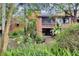 Private backyard with lush landscaping and a view of the home at 1038 E Michigan St # 1, Orlando, FL 32806