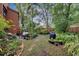 Landscaped backyard with a grilling station and lush greenery at 1038 E Michigan St # 1, Orlando, FL 32806