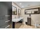 Spa-like bathroom with double vanity and a large mirror at 1038 E Michigan St # 1, Orlando, FL 32806