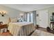 Peaceful bedroom with a queen-size bed and access to a patio at 1038 E Michigan St # 1, Orlando, FL 32806