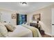 Bright bedroom with a queen-size bed, and patio access at 1038 E Michigan St # 1, Orlando, FL 32806