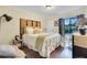 Bedroom with a queen-size bed and sliding doors leading to a patio at 1038 E Michigan St # 1, Orlando, FL 32806