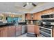 Well-equipped kitchen featuring granite countertops and stainless steel appliances at 1038 E Michigan St # 1, Orlando, FL 32806