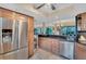 Modern kitchen features stainless steel appliances and wood cabinets at 1038 E Michigan St # 1, Orlando, FL 32806