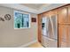 Kitchen area with stainless steel refrigerator and wood cabinets at 1038 E Michigan St # 1, Orlando, FL 32806