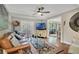 Relaxing living room with a leather sofa and a large TV at 1038 E Michigan St # 1, Orlando, FL 32806