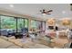 Open concept living room with hardwood floors, fireplace, and access to a patio at 1038 E Michigan St # 1, Orlando, FL 32806