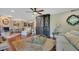 Open living room with hardwood floors, fireplace, and views to dining area at 1038 E Michigan St # 1, Orlando, FL 32806