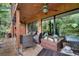 Relaxing patio featuring wicker furniture and ceiling fans at 1038 E Michigan St # 1, Orlando, FL 32806