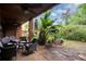 Relaxing patio with wicker furniture and lush landscaping at 1038 E Michigan St # 1, Orlando, FL 32806