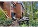 Cozy patio area with wicker furniture, surrounded by tropical plants at 1038 E Michigan St # 1, Orlando, FL 32806